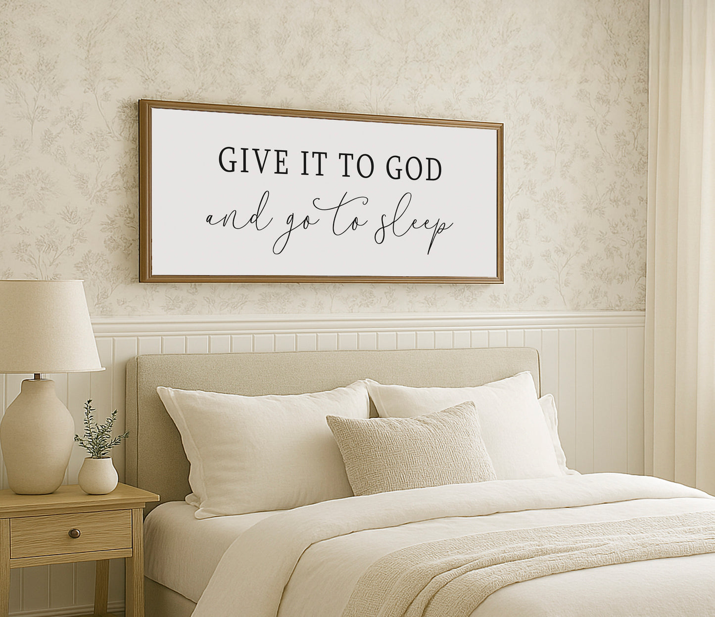 a bed with a white comforter and pillows