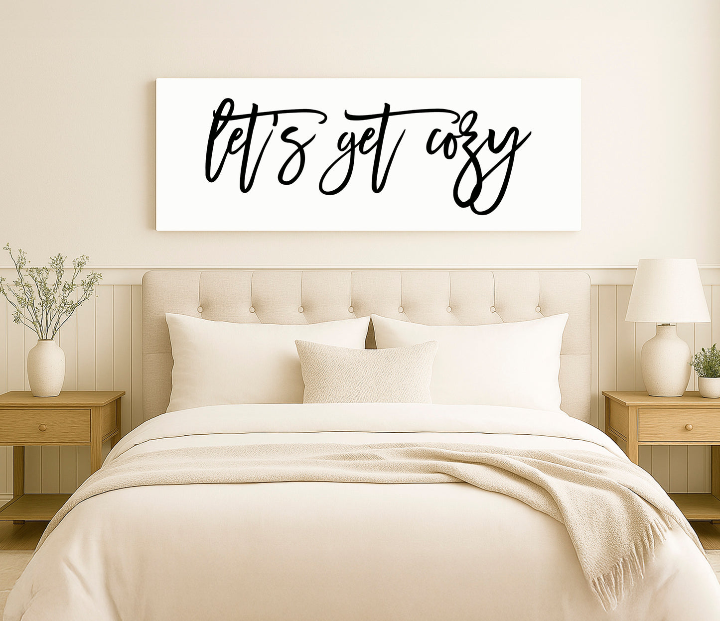 a bed with a white comforter and pillows