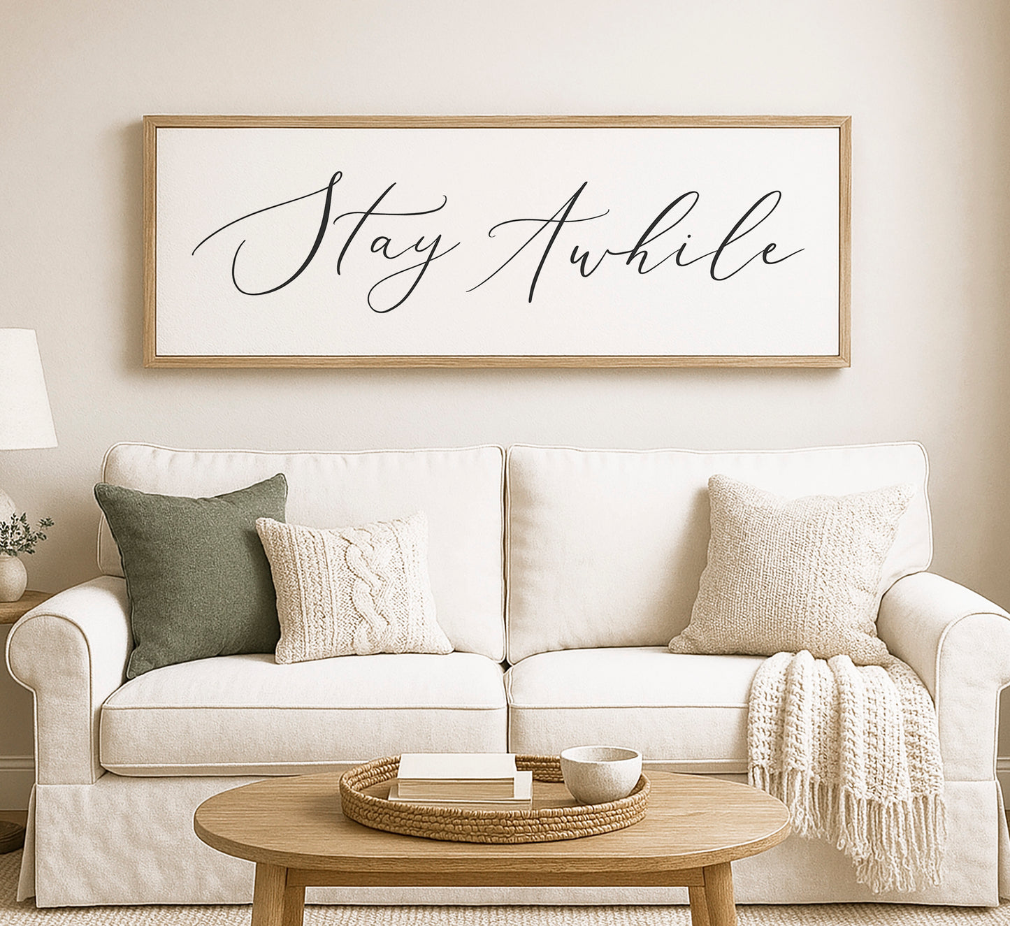 a living room with a white couch and a coffee table