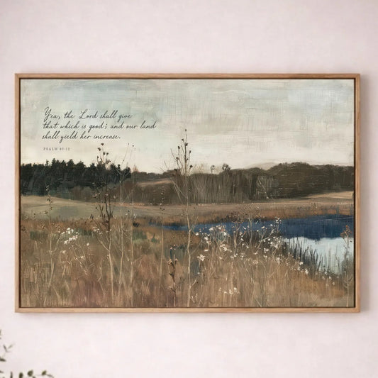 a painting of a serene landscape with a body of water, trees, and a field of tall grass. The painting is hung on a wall above a wooden table with a plant on it.