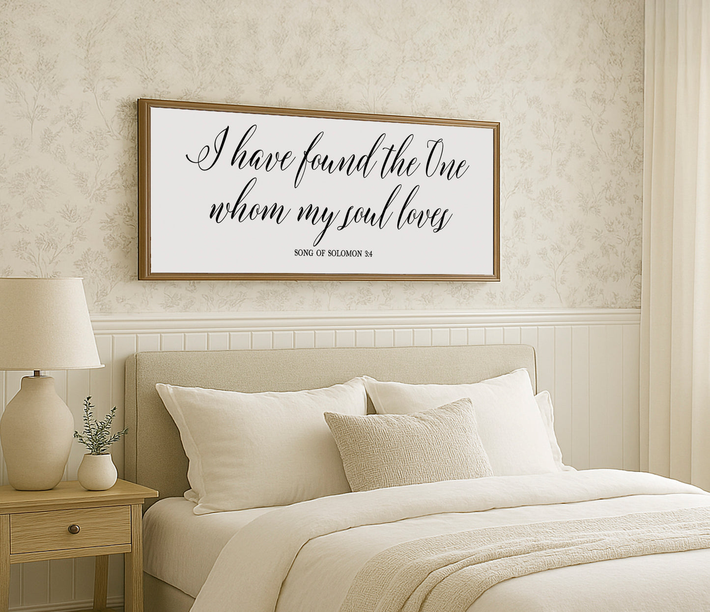 a bedroom with a bed and a picture on the wall