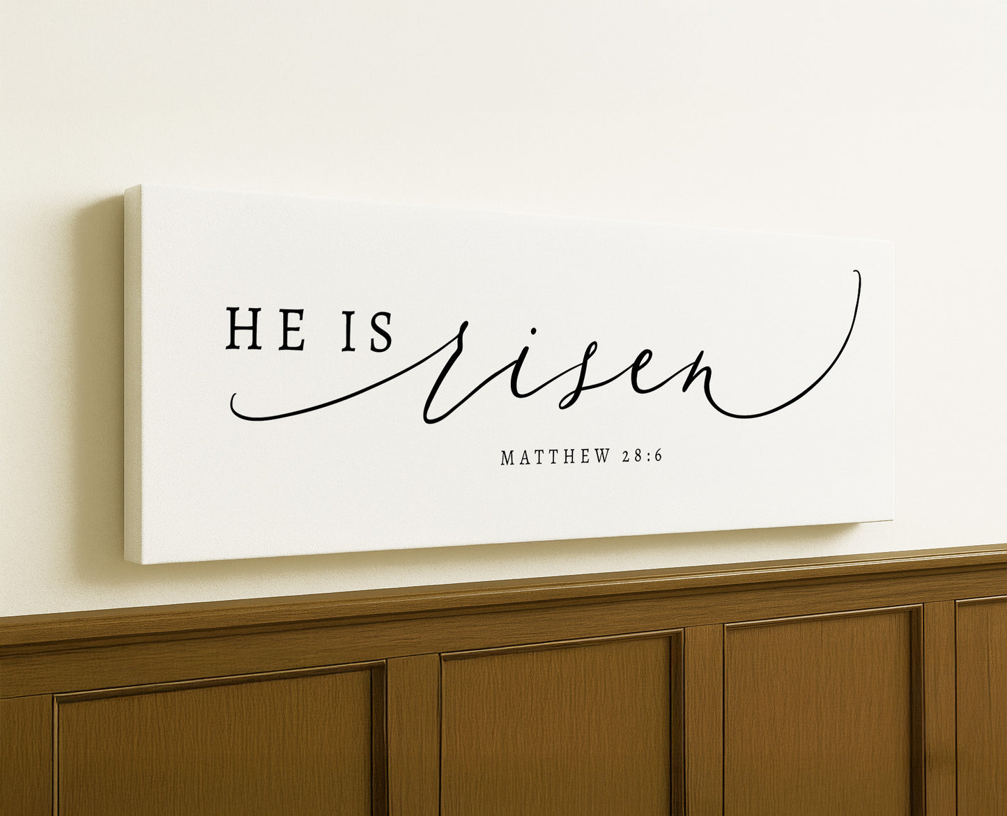 a white canvas with the word he is risen on it