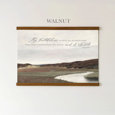The image is a framed painting depicting a serene landscape with a winding river and rolling hills. The painting is mounted on a wall, and there is a quote in cursive text above it that reads