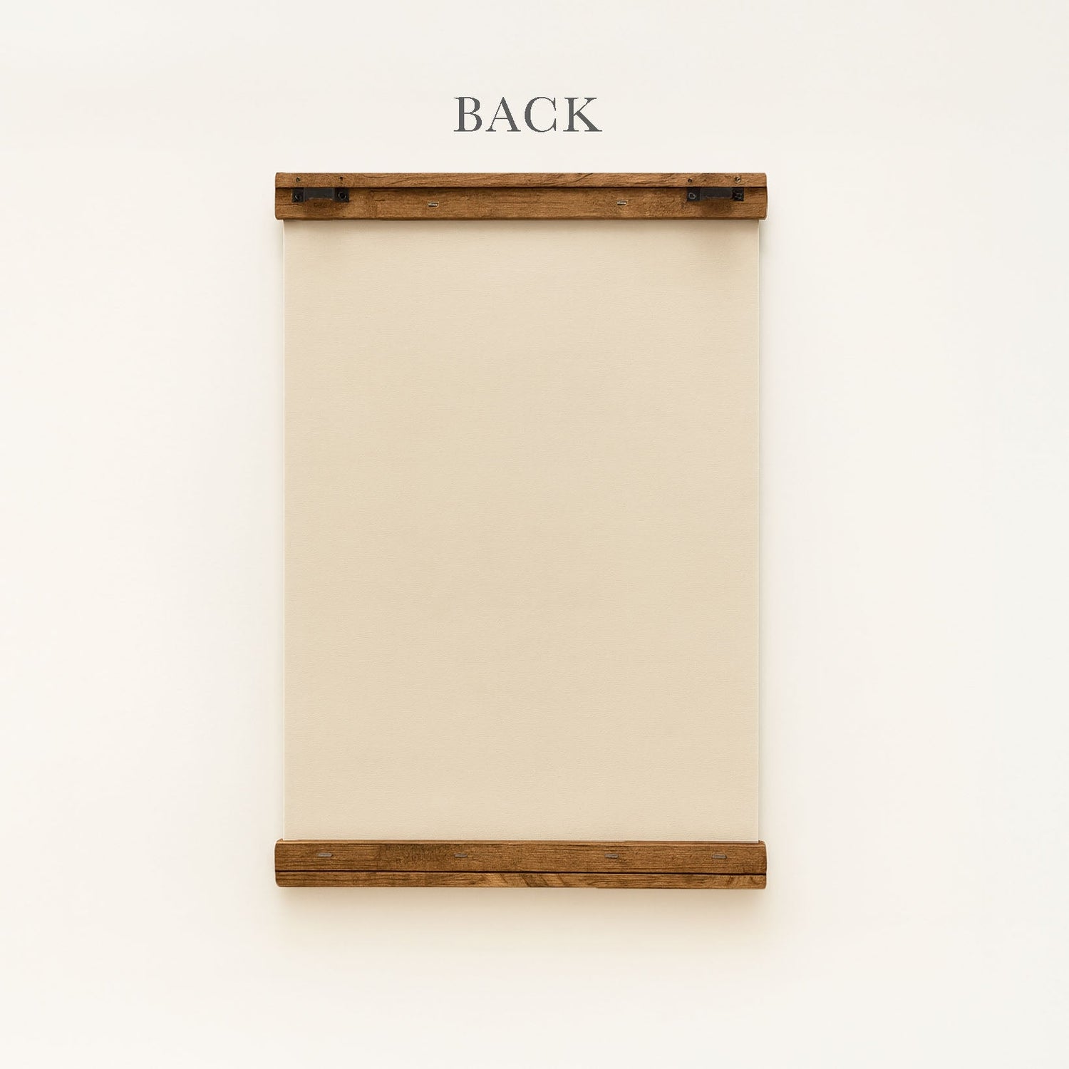 a wooden frame with a blank canvas or paper inside, mounted on a white wall.