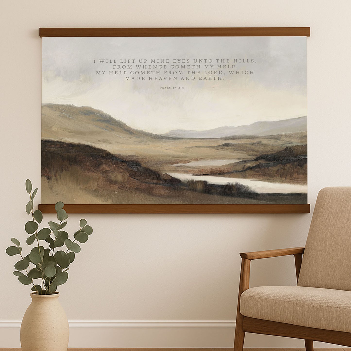 a painting of a serene landscape with rolling hills, a river, and a cloudy sky. The painting is hung on a wall above a wooden chair, which is positioned next to a vase with greenery. The painting is a representation of a peaceful and natural setting, and the wooden chair adds a touch of comfort and relaxation to the scene.