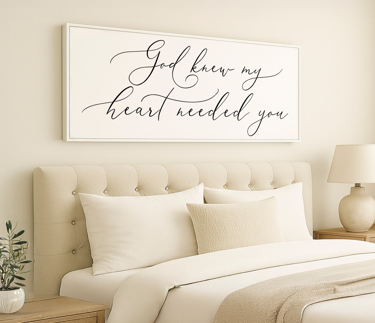 a bedroom with a bed and a picture on the wall