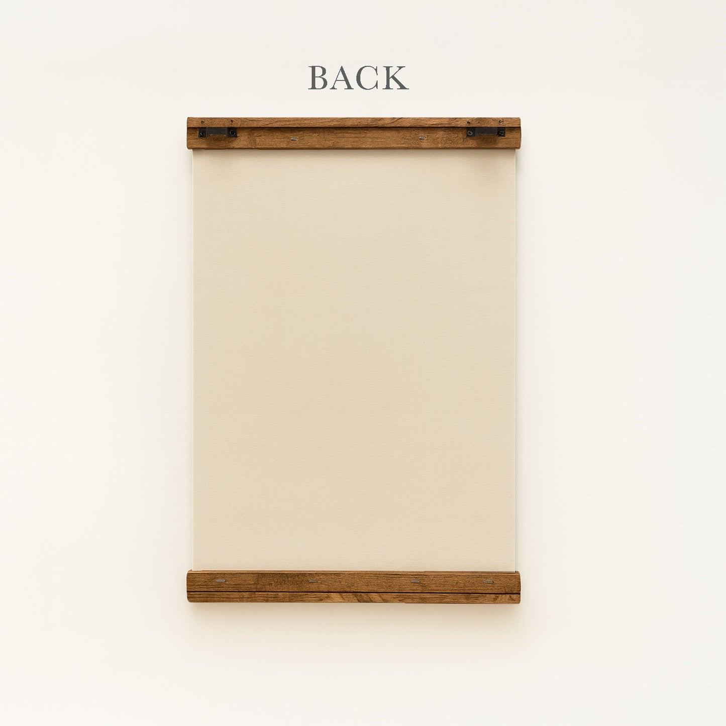 a wooden frame with a blank canvas or paper inside, mounted on a white wall.
