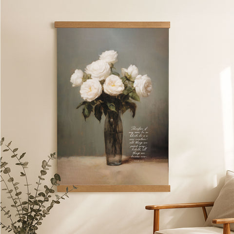 a painting of a vase filled with white roses, hanging on a wall next to a wooden chair.