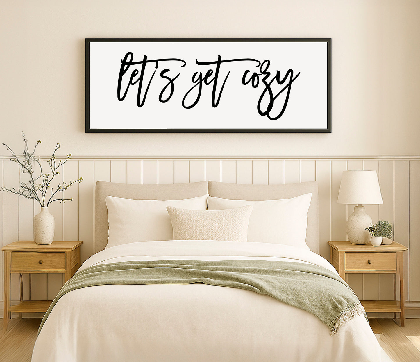 a bedroom with a bed, nightstands, and a picture on the wall