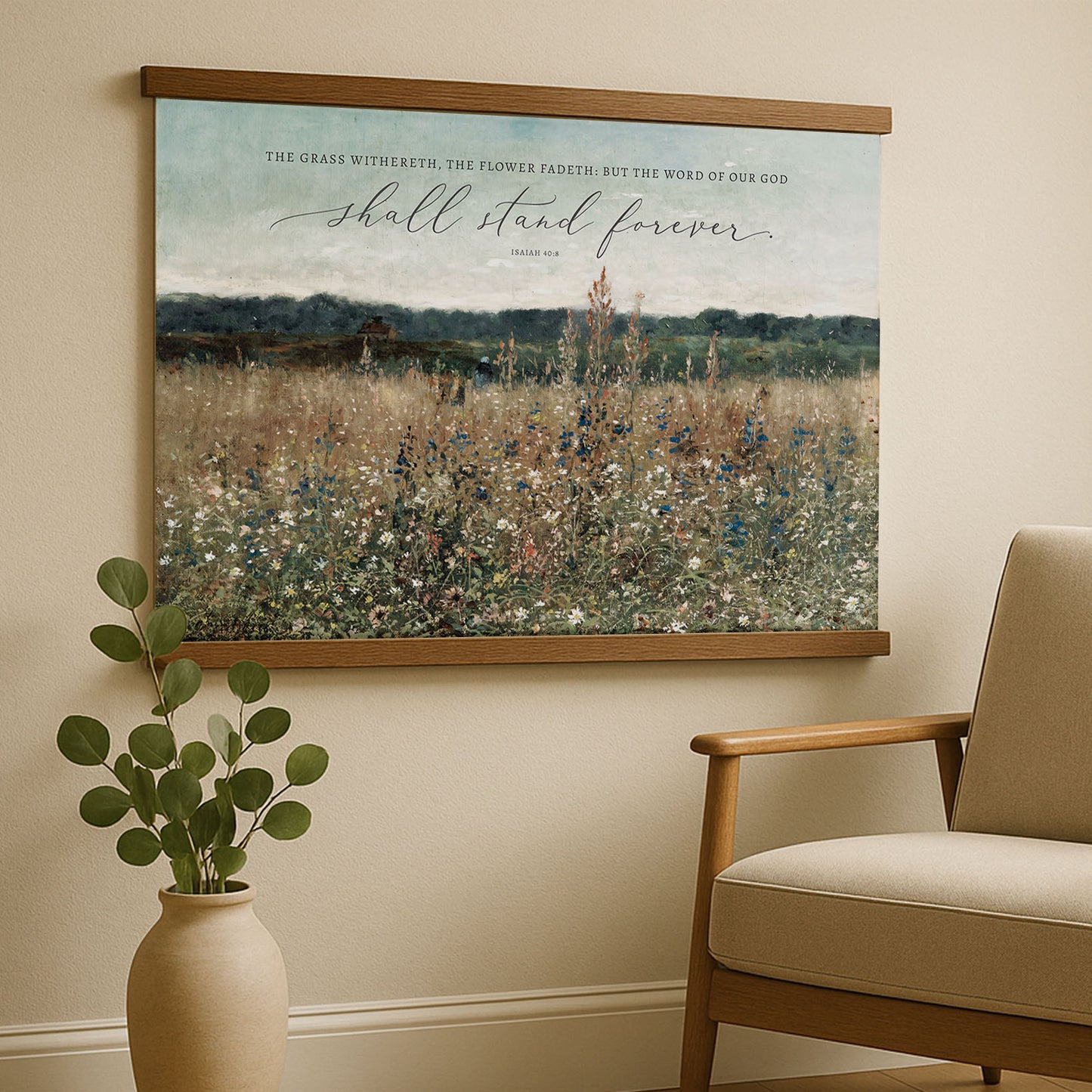 a large framed print of a pastoral landscape with a quote from Isaiah 61:3, "The grass witheth the flower, but the word of our god shall stand forever."