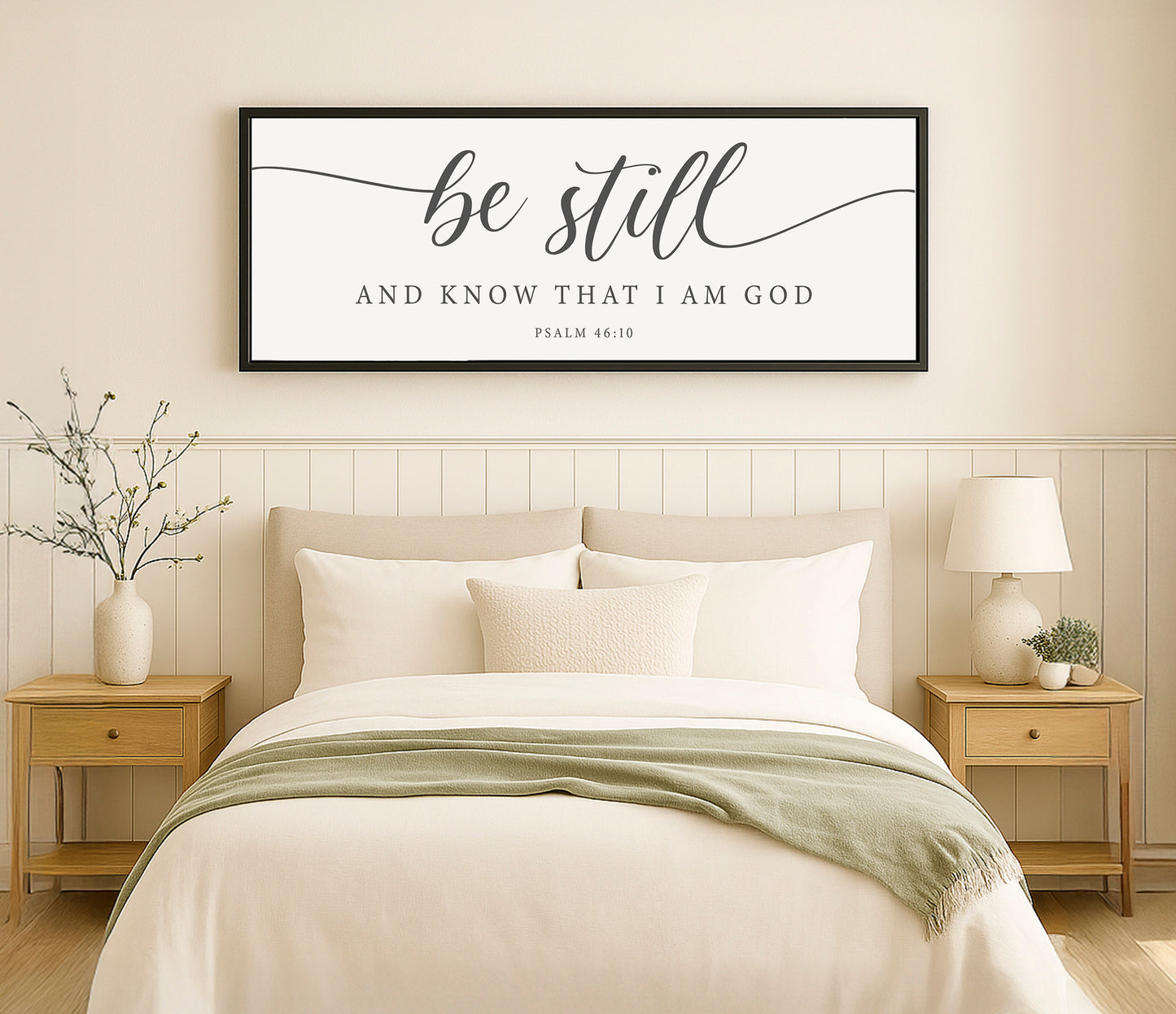 a bedroom with a bed, nightstands and a framed poster