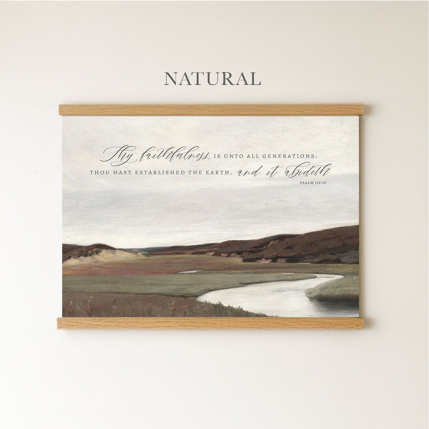 The image is a framed print of a landscape with a river and mountains in the background.
