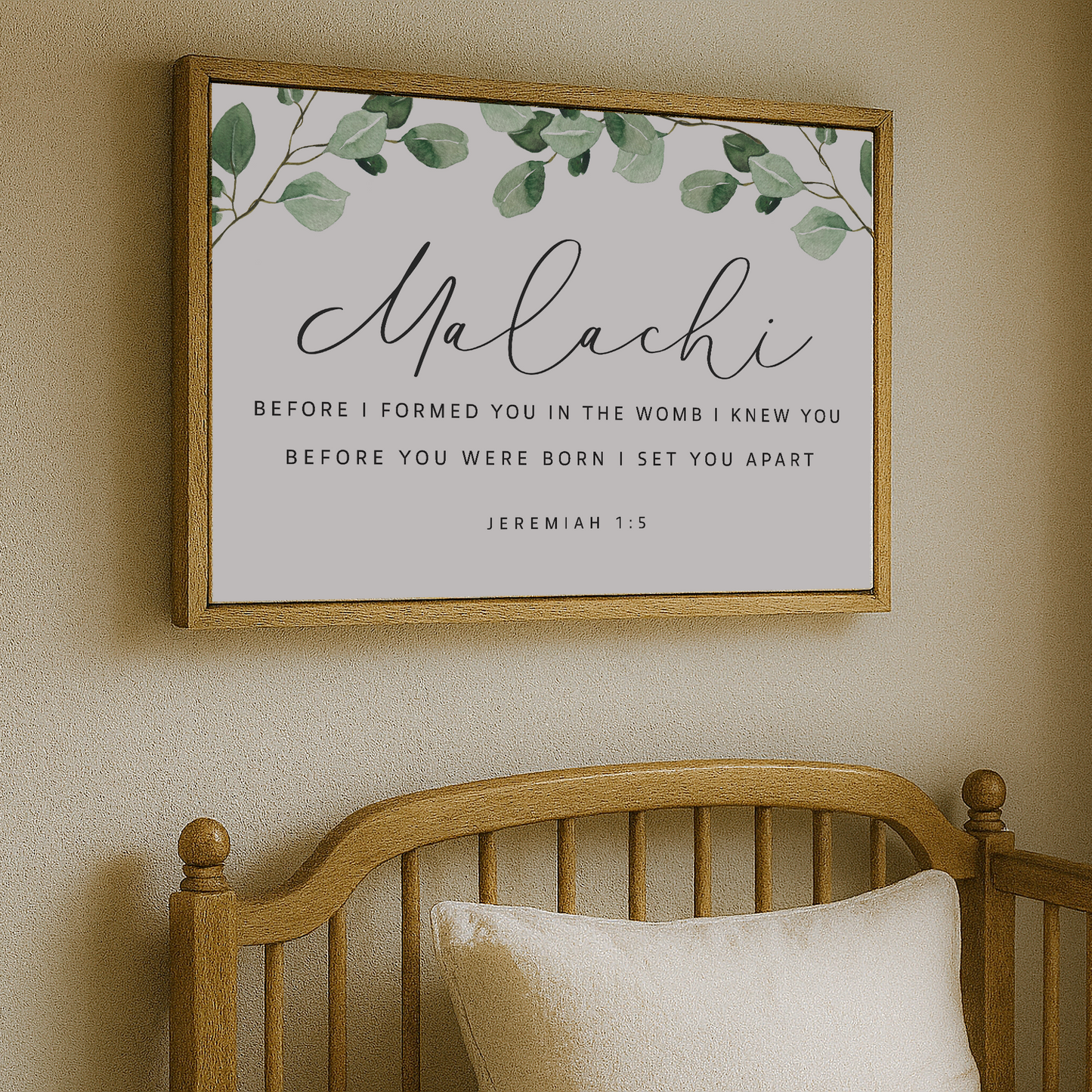 a wooden crib with a framed Bible verse above it, which reads "Malachi: Before I formed you in the womb I knew you before you were born I set you apart Jeremiah 1:5".