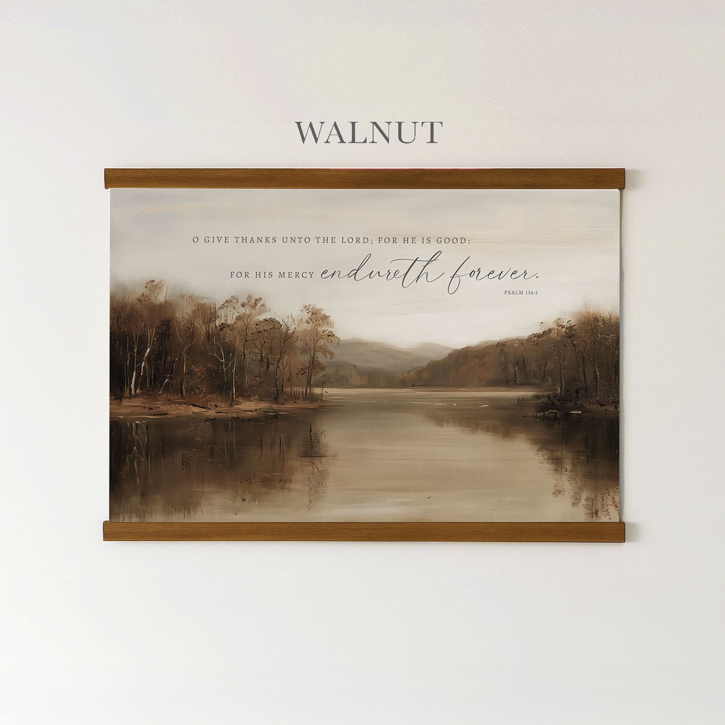 The image is a framed print of a serene landscape featuring a lake surrounded by trees, with a quote from the Bible above it.
