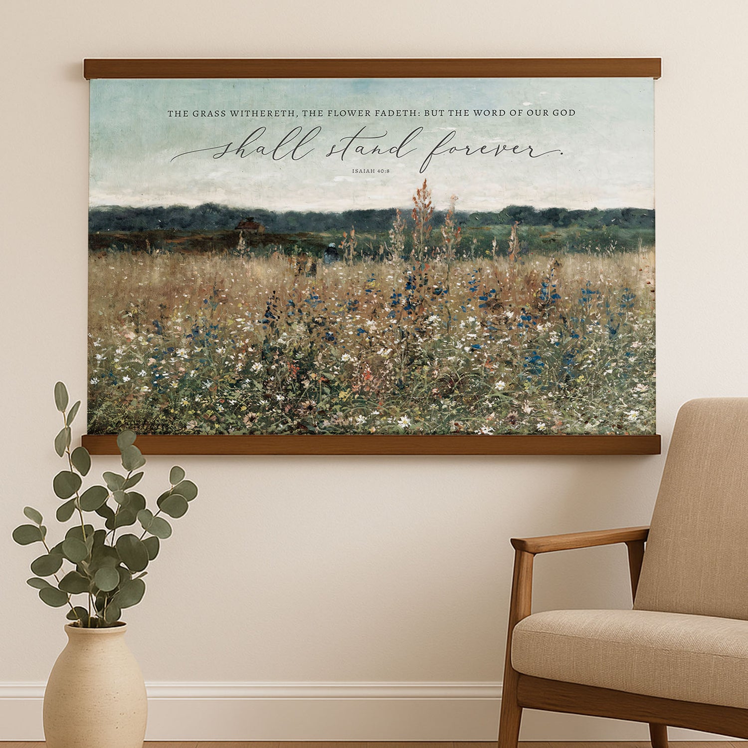 a large painting of a field with flowers hanging on a wall, accompanied by a quote from the Bible verse Isaiah 40:8.