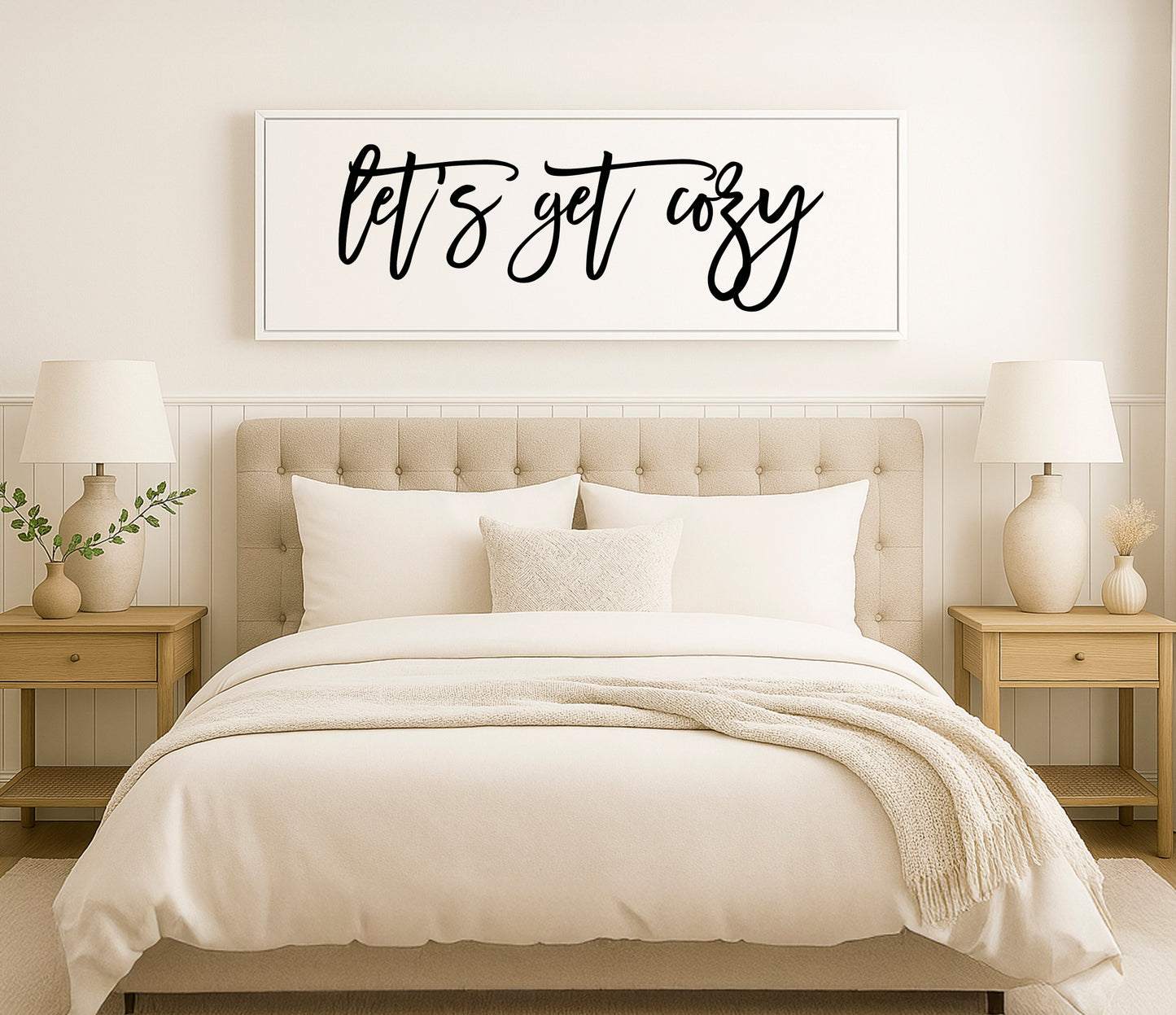 a bed with a white comforter and pillows