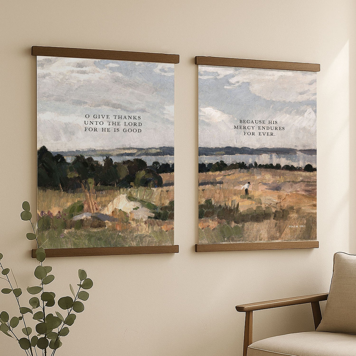 two framed paintings hanging on a wall, depicting a serene landscape with a person walking in the distance.