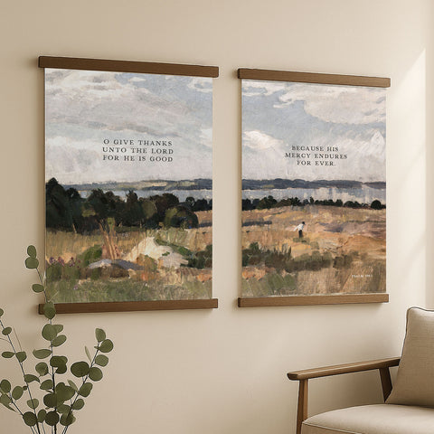 two framed paintings hanging on a wall, depicting a serene landscape with a person walking in the distance.