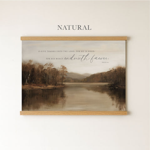 The image is a framed print of a serene landscape featuring a calm lake surrounded by trees. The text above the print reads