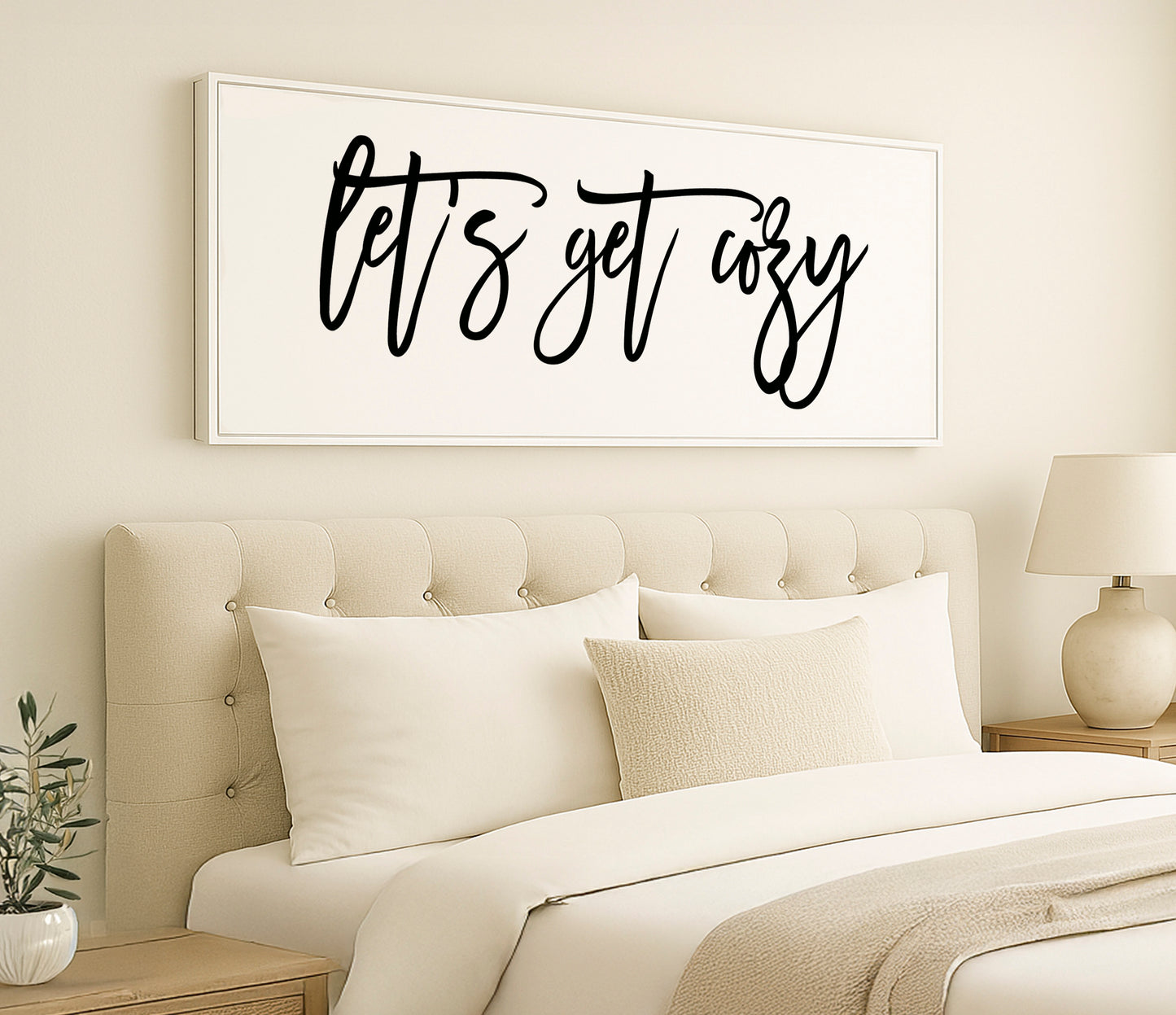 a bedroom with a bed, nightstand, and a painting on the wall