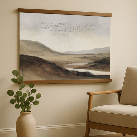 a serene landscape painting hanging on a wall, with a potted plant and a wooden armchair in the foreground.