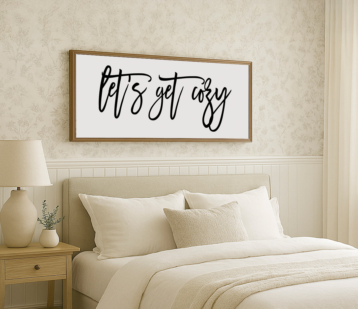 a bedroom with a bed, nightstand, and a picture on the wall
