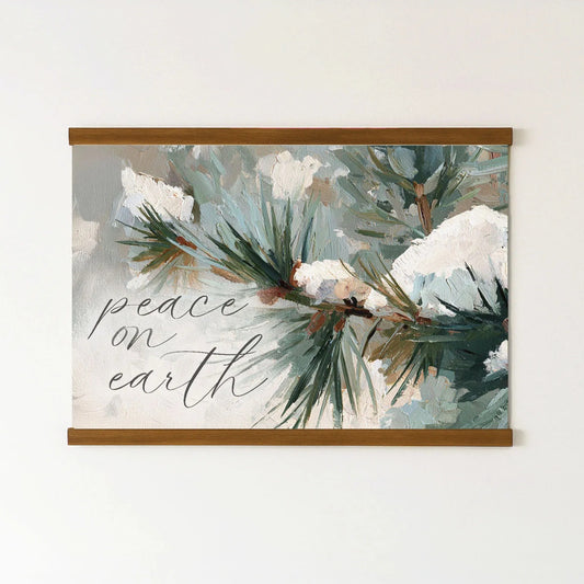 The image is a painting of pine branches with snow on them, and it has the text "Peace on earth" written on it.