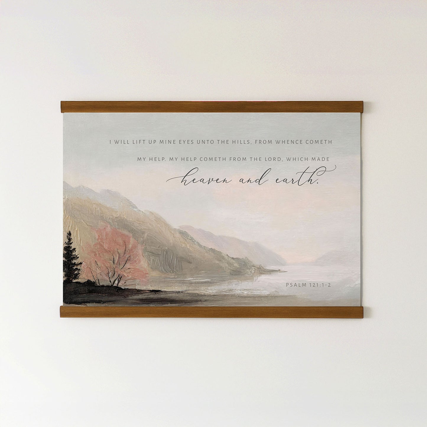 The image is a framed print featuring a serene landscape with mountains, trees, and a body of water. The text overlay provides a biblical verse from Psalm 112:1-2, which reads "I will lift up my eyes unto the hills from whence cometh. My help, my help cometh from the Lord, which made heaven and earth."