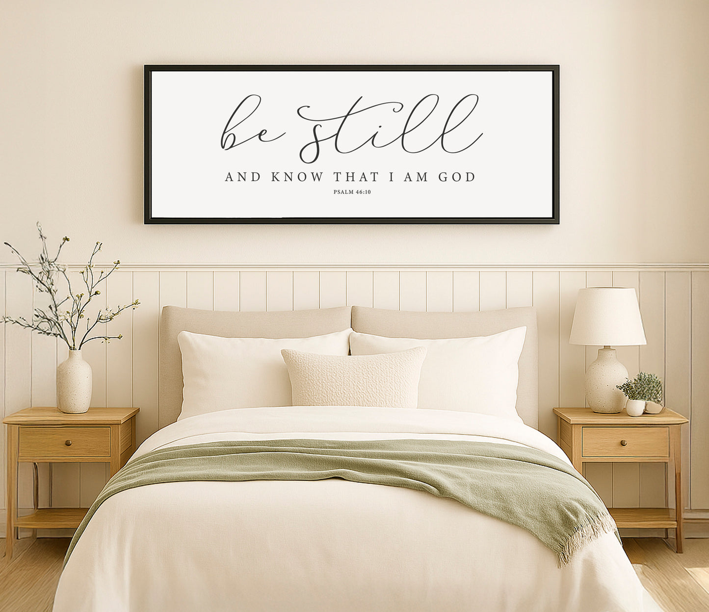 a bedroom with a bed, nightstands and a framed picture