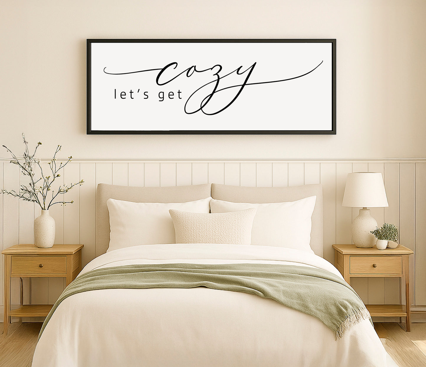 a bed with a white comforter and pillows