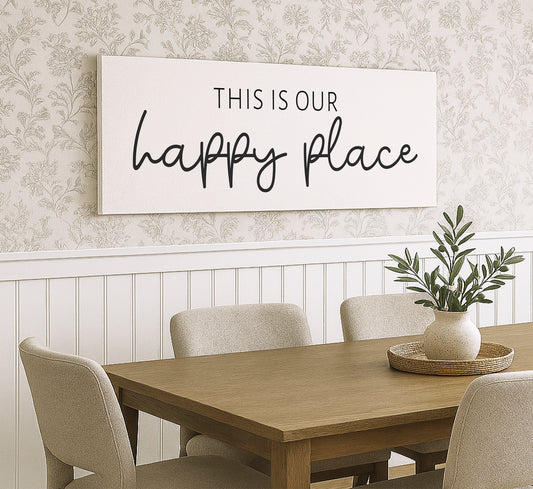 a dining room table with chairs and a sign on the wall