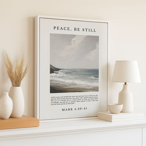 A framed painting of a serene ocean landscape is displayed on a white shelf, accompanied by a lamp, a vase with wheat stalks, and a bowl. The painting is titled 