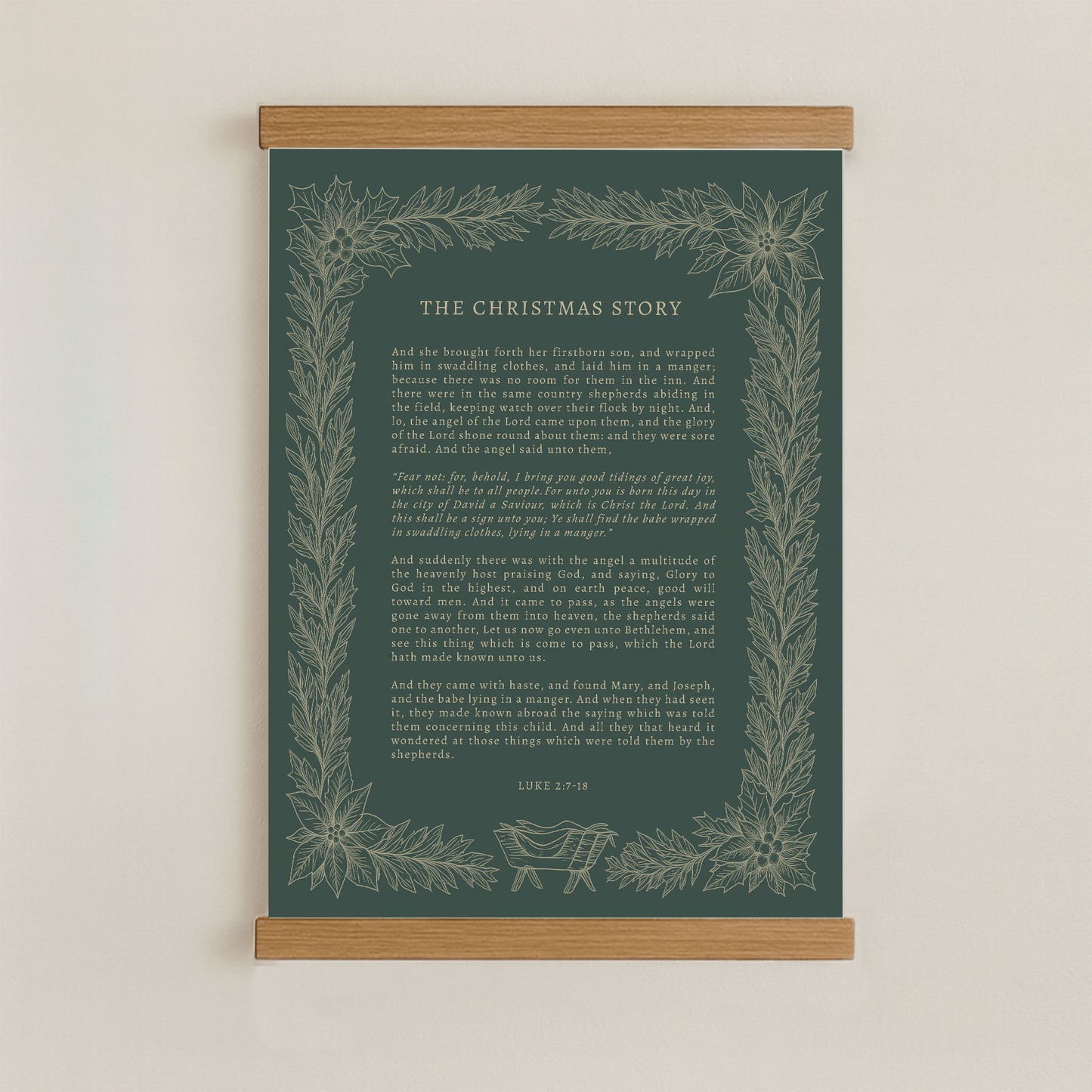 The image is a framed print of a Christmas-themed text, with a dark green background and a decorative border of leaves and flowers.
