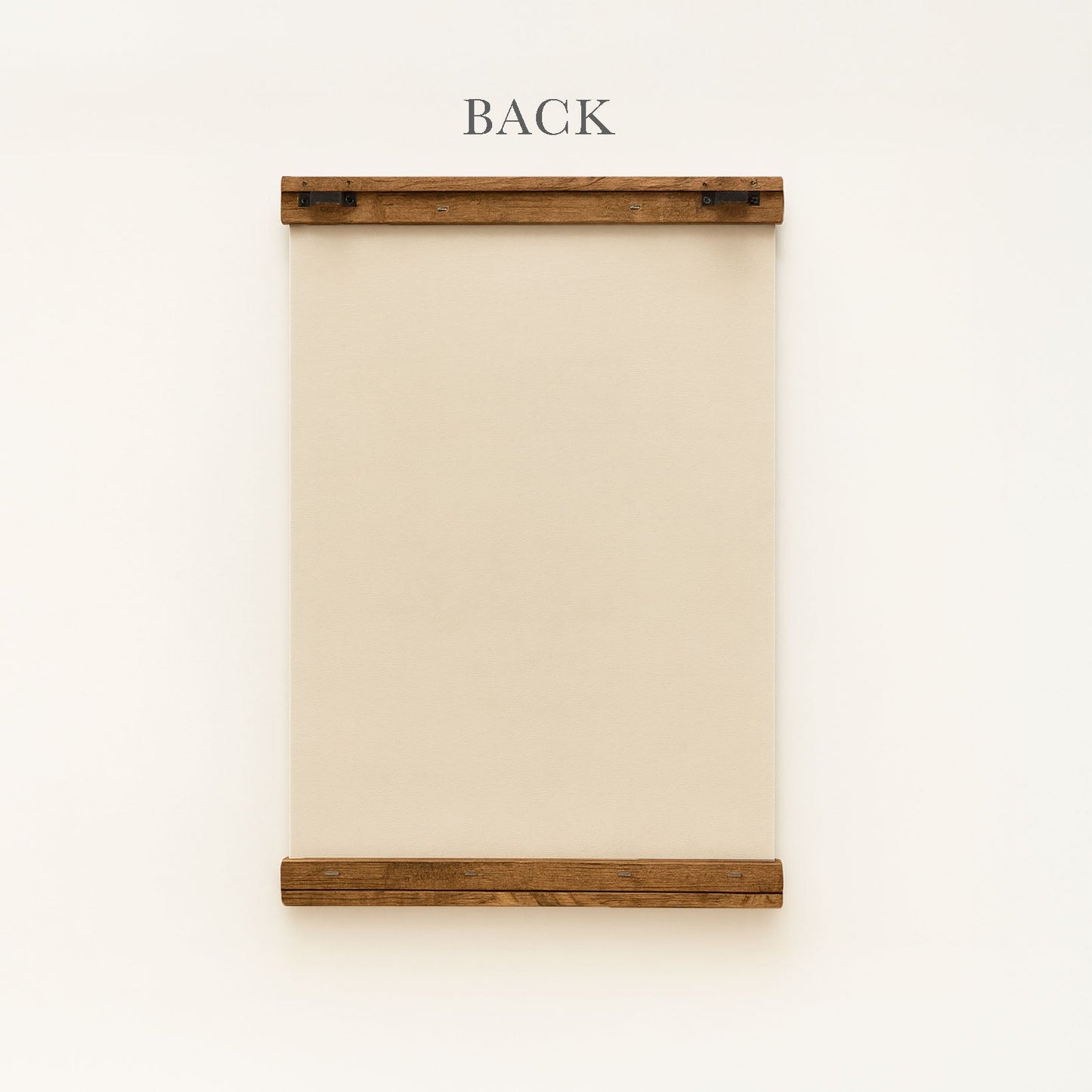 a wooden frame with a blank canvas or paper inside, mounted on a white wall.
