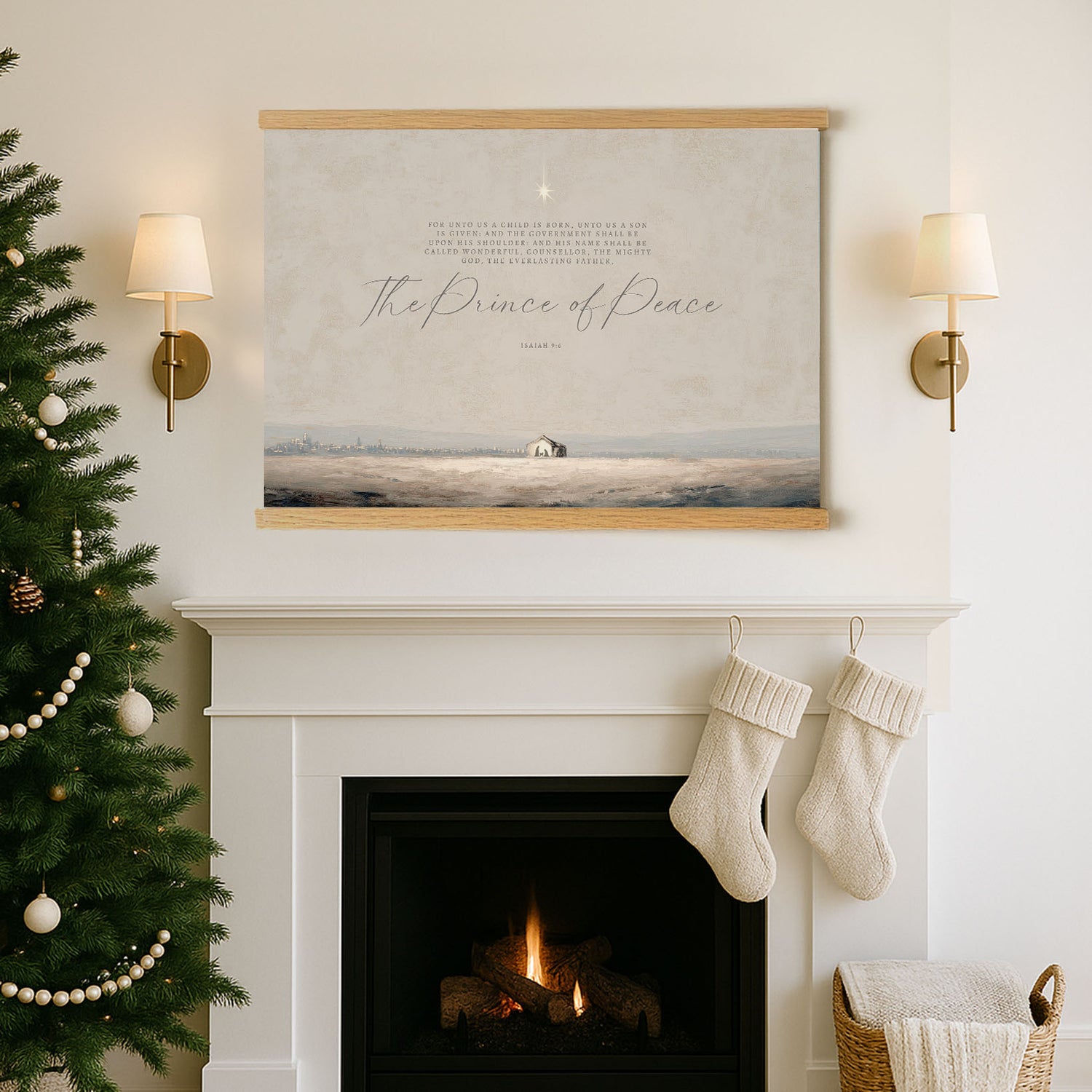 a cozy Christmas scene with a fireplace, a Christmas tree, and a framed poster of a serene landscape above it.