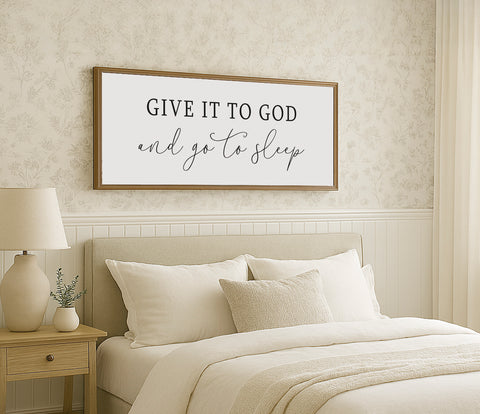 a bed with a white comforter and pillows