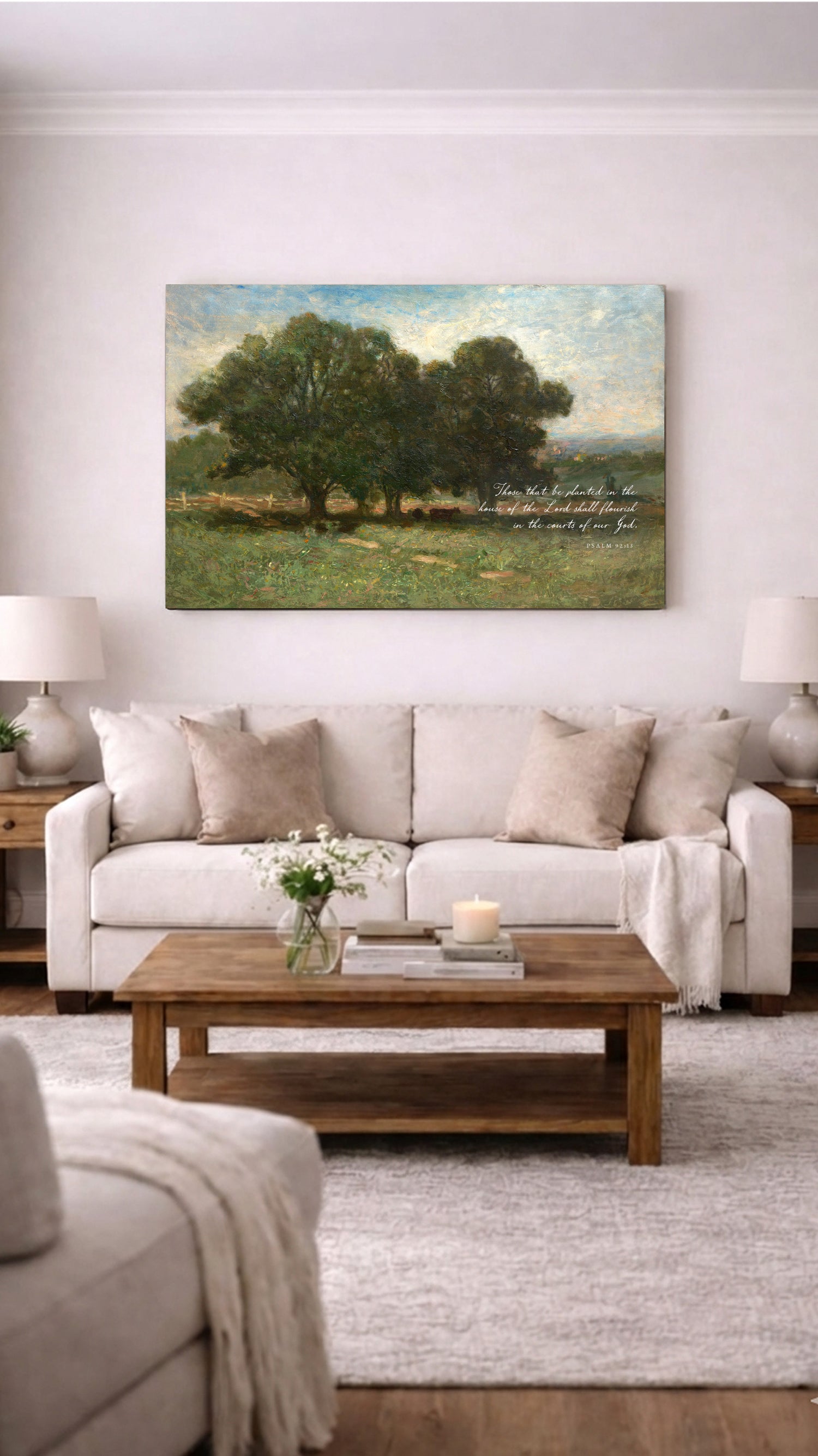a cozy living room with a large painting of a serene landscape hanging on the wall above a beige sofa and a wooden coffee table.
