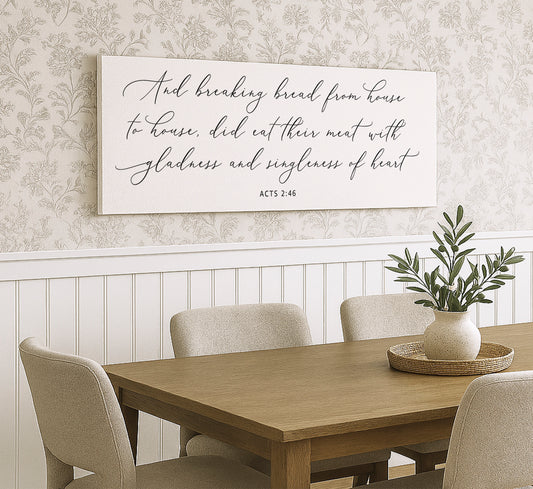 a dining room table with a vase of flowers on it