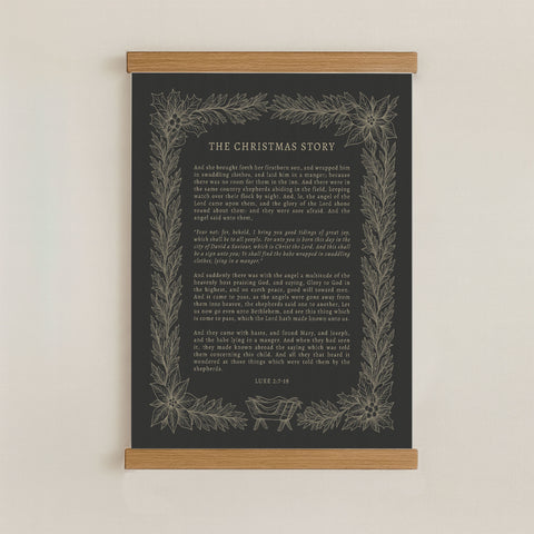 The image is a poster or framed print of a Christmas-themed text, with a dark background and a decorative border.