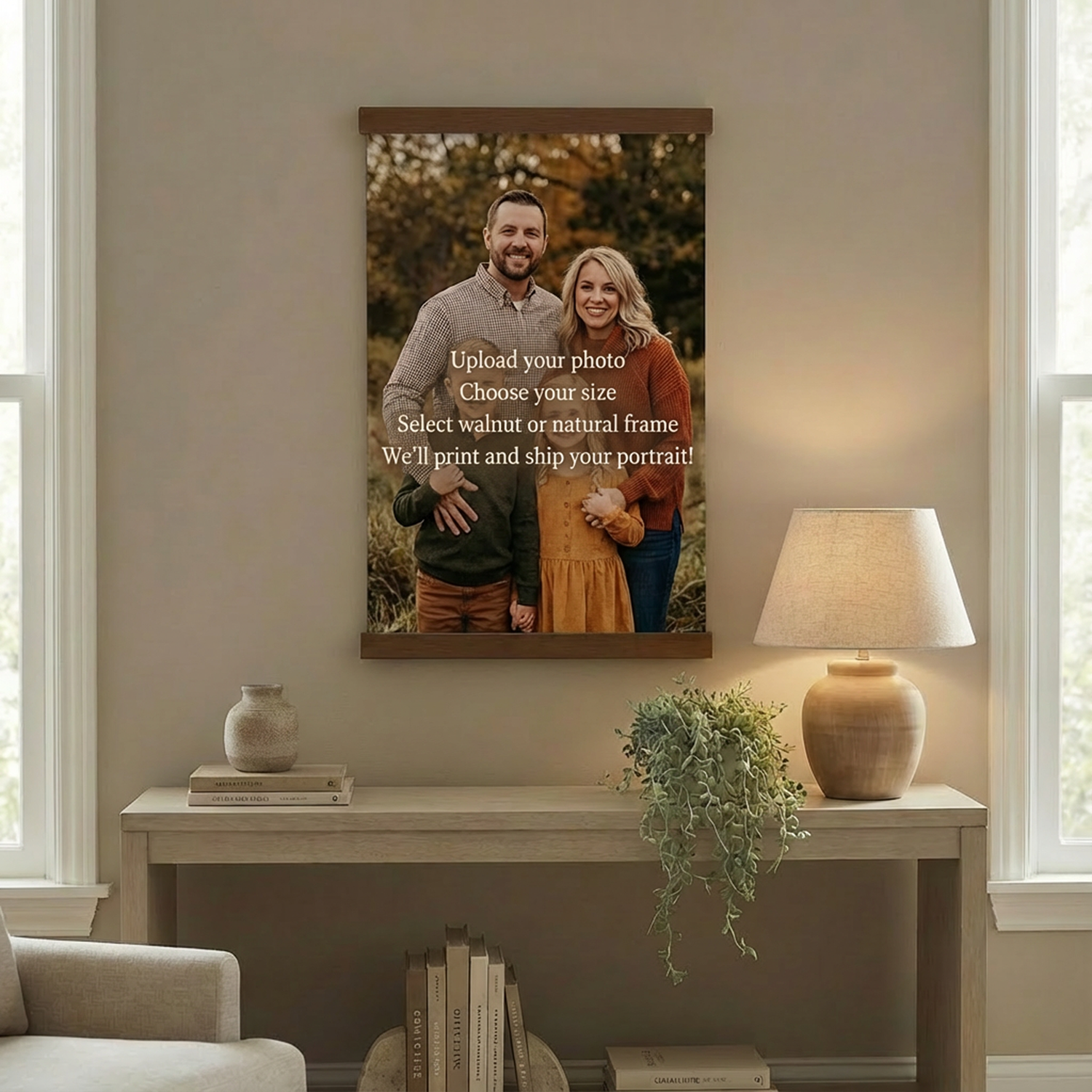 a living room with a framed photo of a family hanging on the wall. The photo includes a man, a woman, and a child. The wall is decorated with various items, such as a lamp, a plant, and a stack of books.