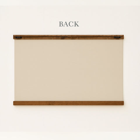 a blank canvas or board mounted on a wall, with the word 