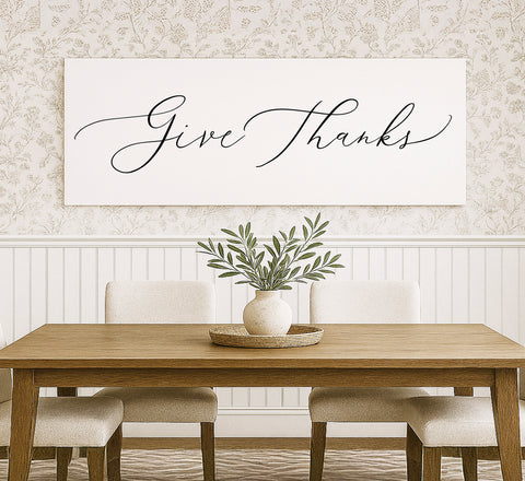 a dining room table with a vase of flowers on it
