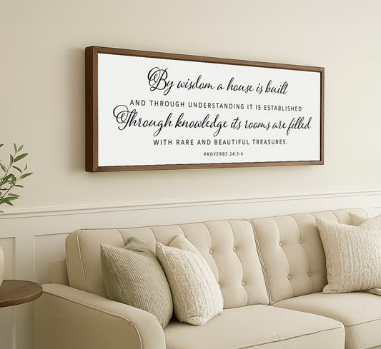 a living room with a couch and a framed quote on the wall