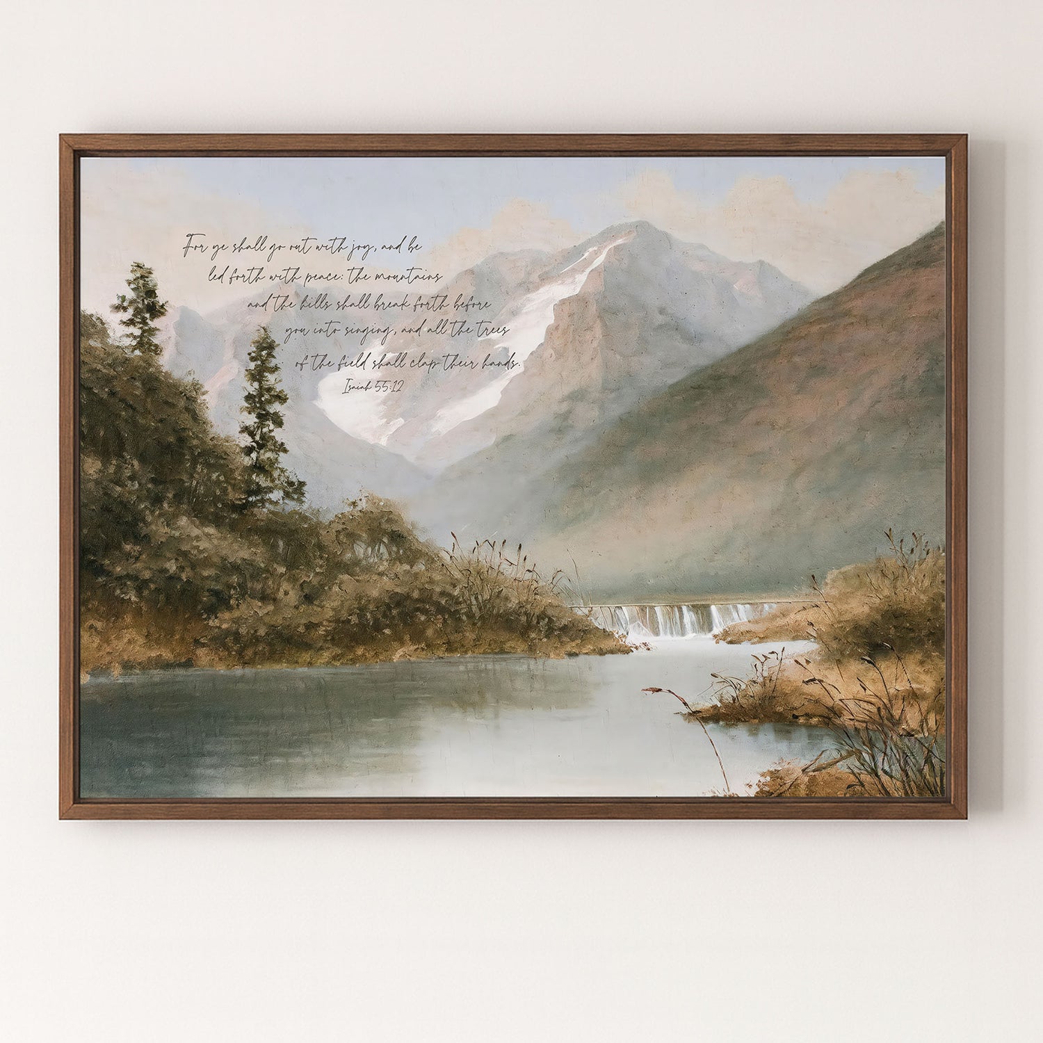 The image is a framed painting depicting a serene mountain landscape with a calm lake in the foreground. The painting features a lush, verdant scene with trees and a waterfall cascading down the mountainside. The text overlay on the painting reads "For you shall go with joy and be happy and with the peace that shall break before you enter into singing and all the Trees of the Bible will stop their branches."