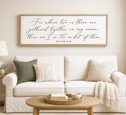 a living room with a white couch and a coffee table