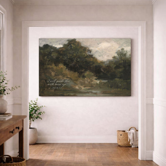 a large landscape painting hanging on a white wall in a room with a wooden floor.