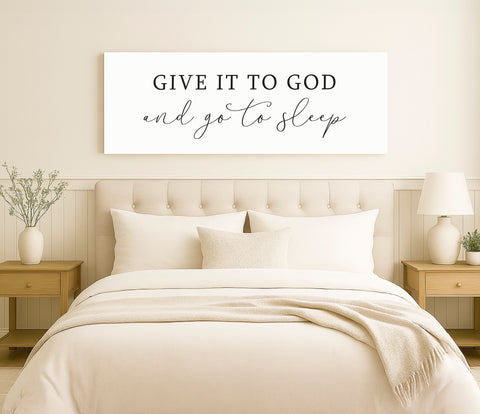 a bed with a white comforter and pillows