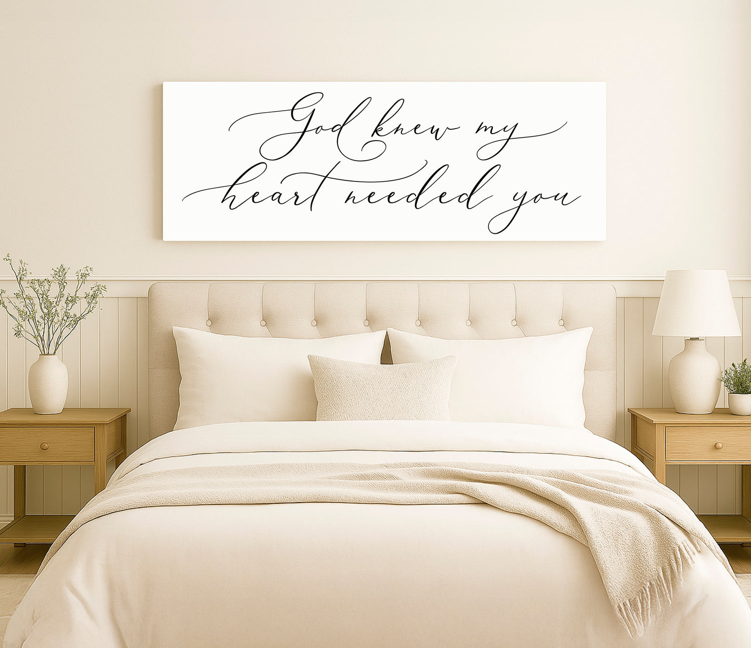 a bed with a white comforter and pillows