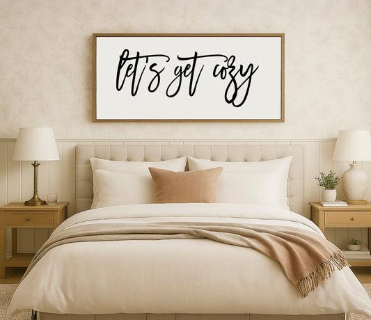 a bedroom with a bed and a picture on the wall