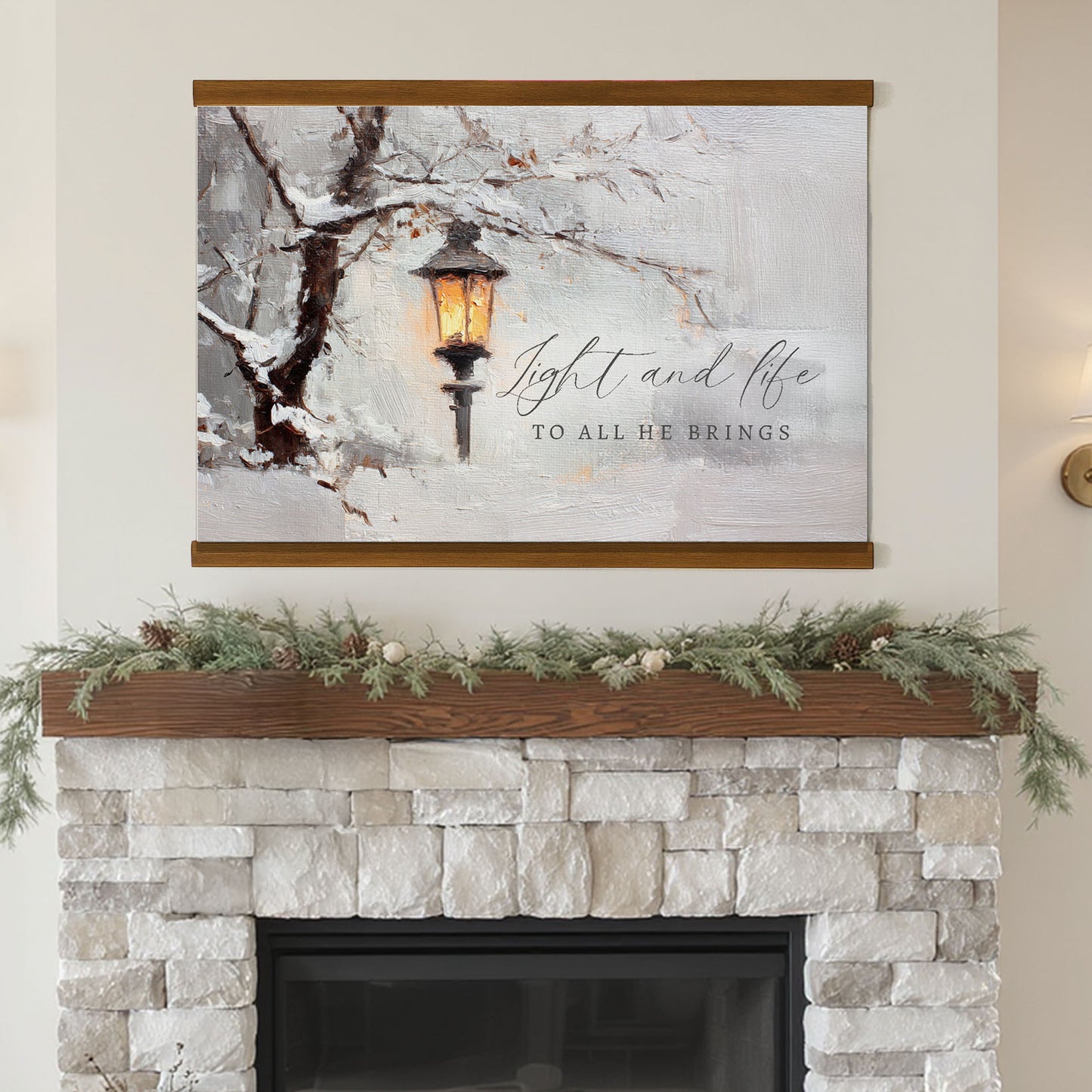 a fireplace with a painting of a street lamp and a snowy tree above it, and a wreath on the mantel below.